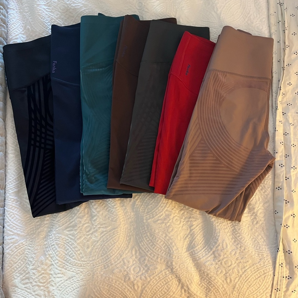 2 pairs of Fanka reversible leggings size small.